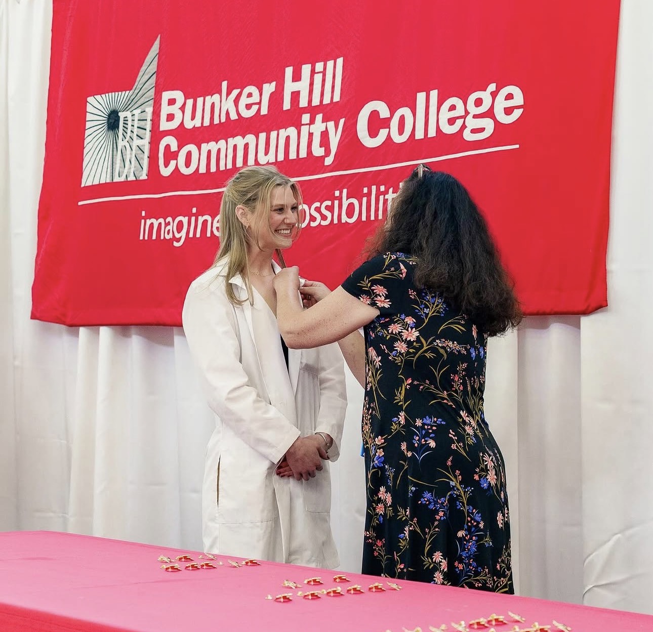 BHCC nursing student receiving her white-coat pin